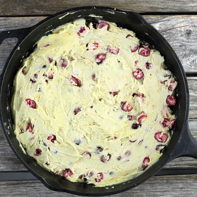 The cake batter spread in the skillet.