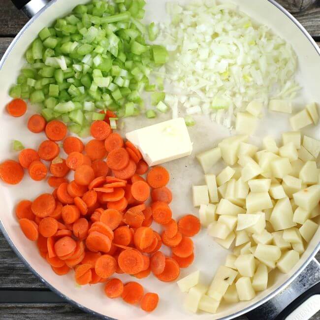 Vegetable in a skillet for the tater tot chicken pot pie casserole.