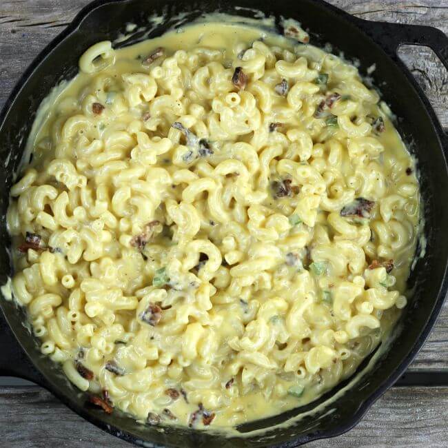 Macaroni and cheese in a cast-iron skillet.