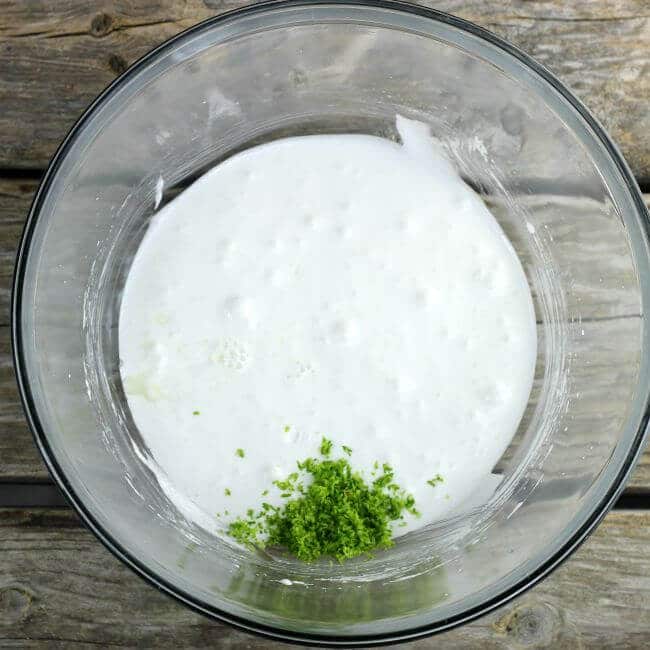 Lime zest and juice added to beaten egg whites.