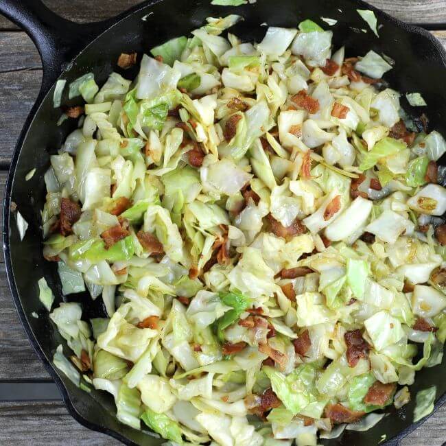 Fried cabbage in a skillet that is ready to serve.