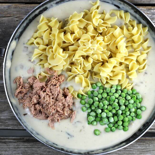 Tuna, egg noodles, and peas added to the mushroom sauce.