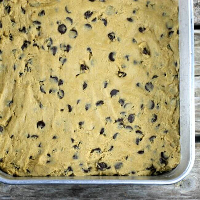 Batter is patted in the baking pan.