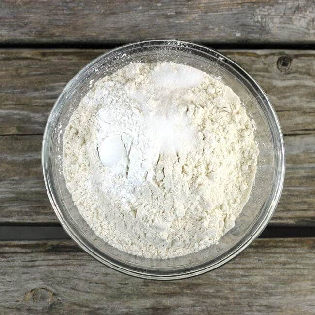 Flour, salt, and baking powder in glass bowl.