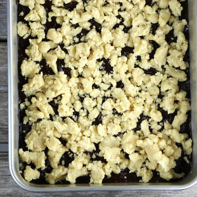 Crumble topping is sprinkled over to of the chocolate.