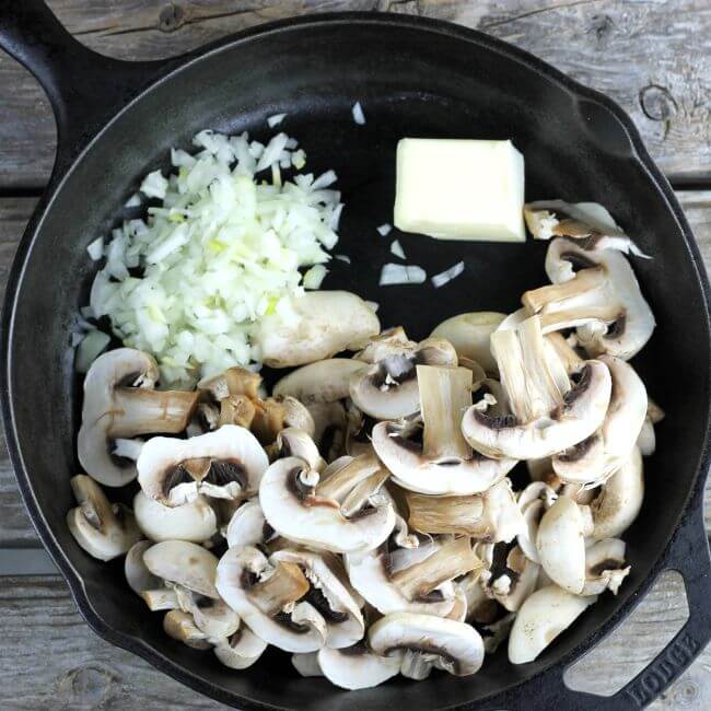 Mushrooms, onions, and butter in a skillet.