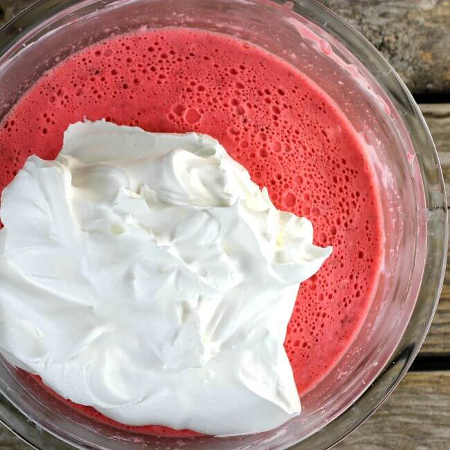 Cool Whip is added to the Jello mixture.