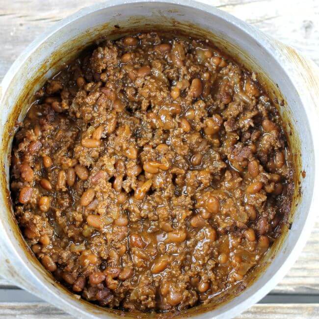 Baked beef and beans in a Dutch oven.