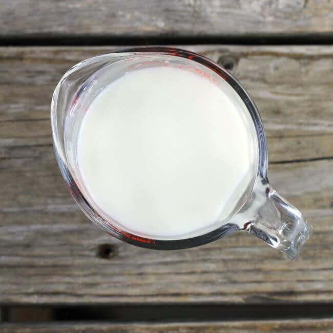 Buttermilk in a measuring cup.