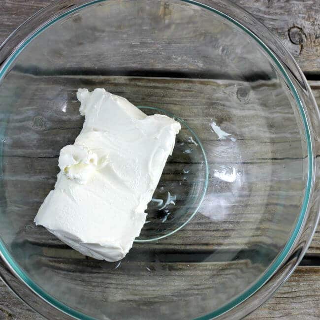 Cream cheese in a glass bowl.