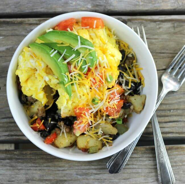 Looking down at a bowl of southwest breakfast bowl.