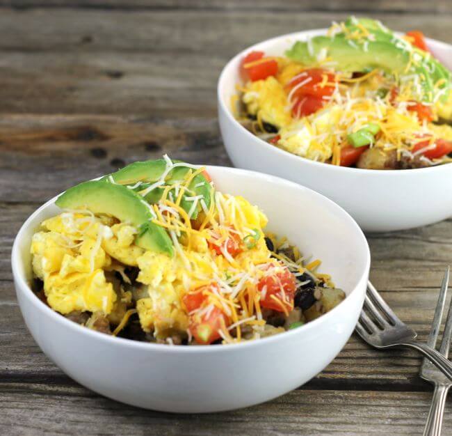 Two bowls of southwest breakfast bowls.