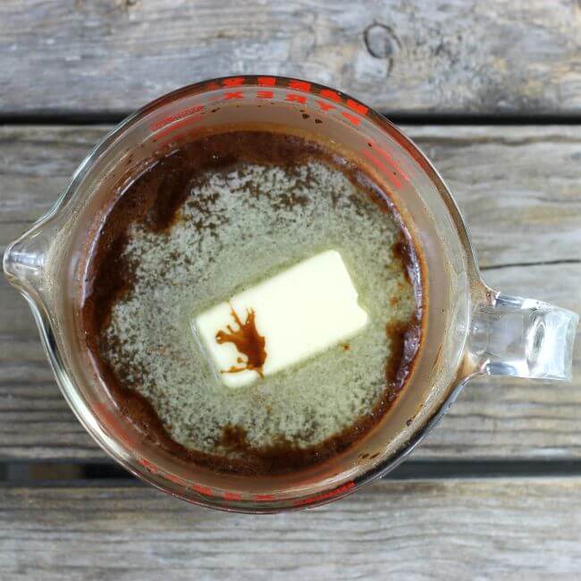 Butter is added to the hot fudge.