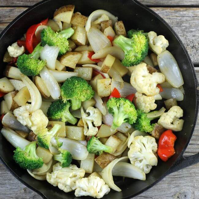Vegetables in a cast-iron skillet.