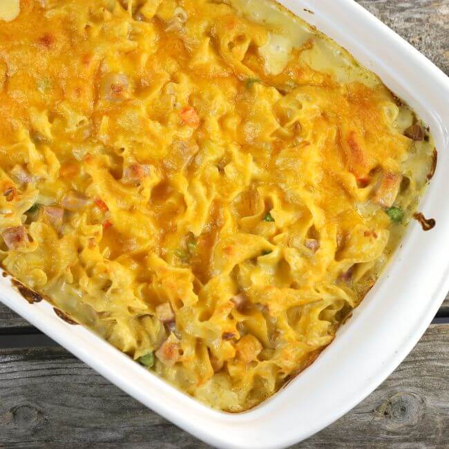 Baked ham and noodle casserole in a baking pan.