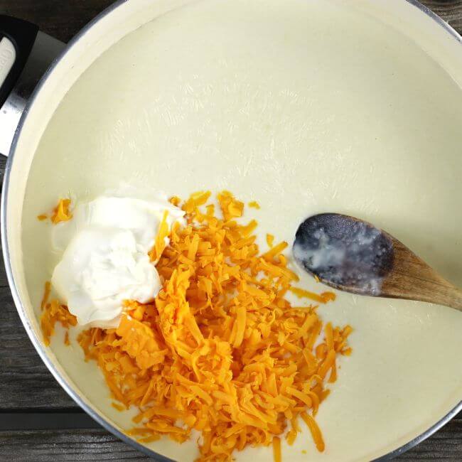 Cheddar cheese and sour cream is added to the white sauce.