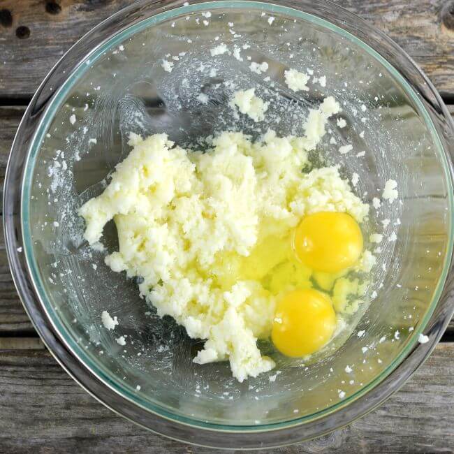 Eggs are added to the beaten sugar and butter.