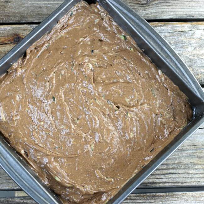 The cake batter is spread in the baking pan.