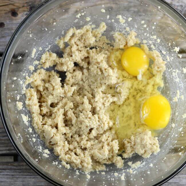 Two eggs are added to the batter.