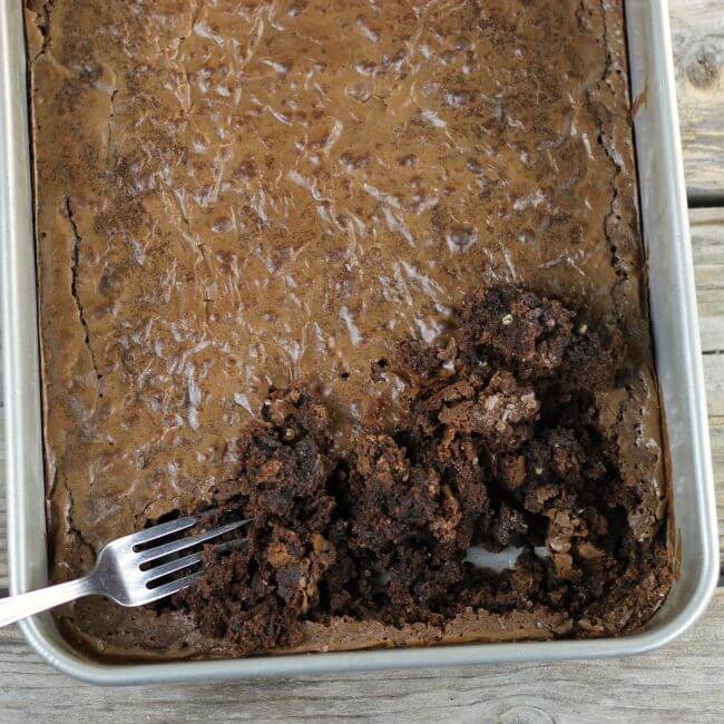 Breaking up the brownies with a fork.