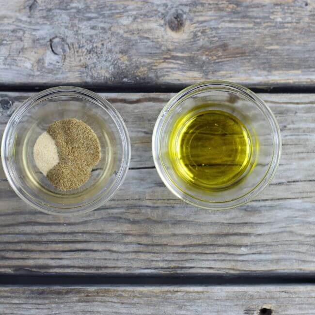 Seasonings and oil in small bowls.