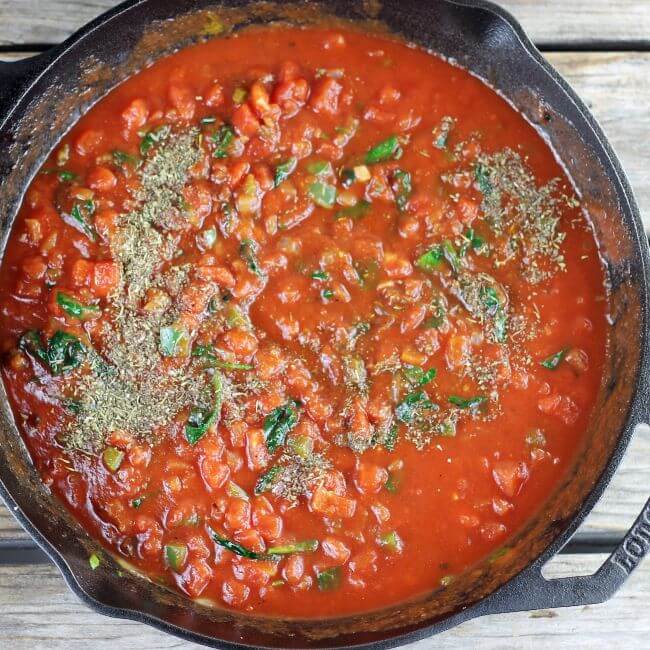 Italian seasoning is added to the sauce.