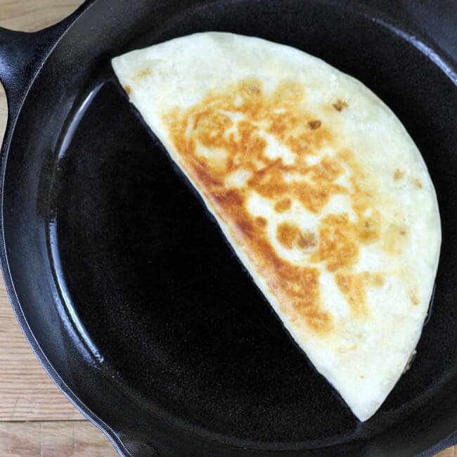 Quesadilla is browned in a skillet.
