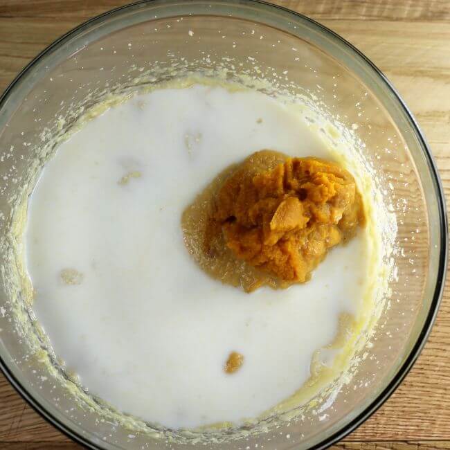 Pumpkin puree and milk are added to the batter.