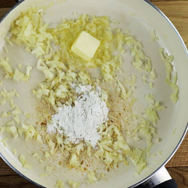 Flour is added to the butter and onions.