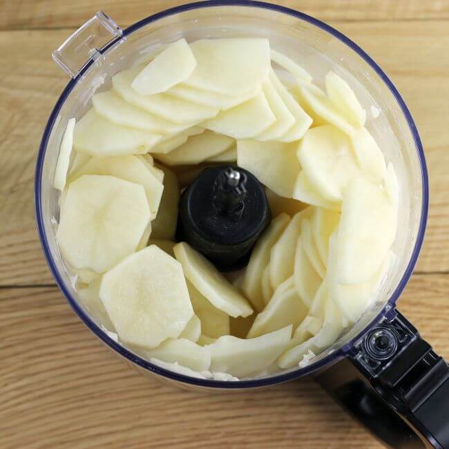 Sliced potatoes in a food processor