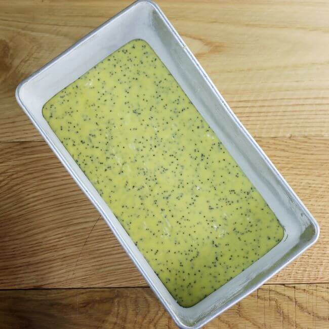 The batter is poured into the loaf pan. 