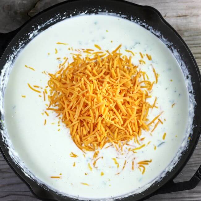 Cheese is mixed into the cream mixture.