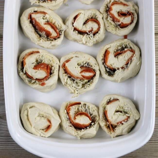 Unbaked rolls in a baking pan.