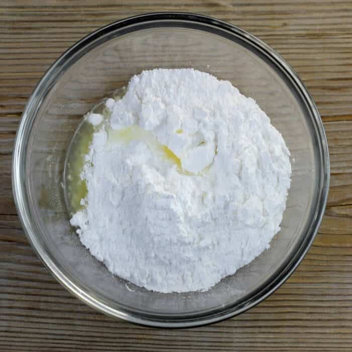 Lemon juice and powdered sugar are added to a small bowl.
