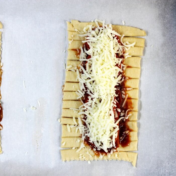 Mozzarella cheese is added to the top of the pepperoni.