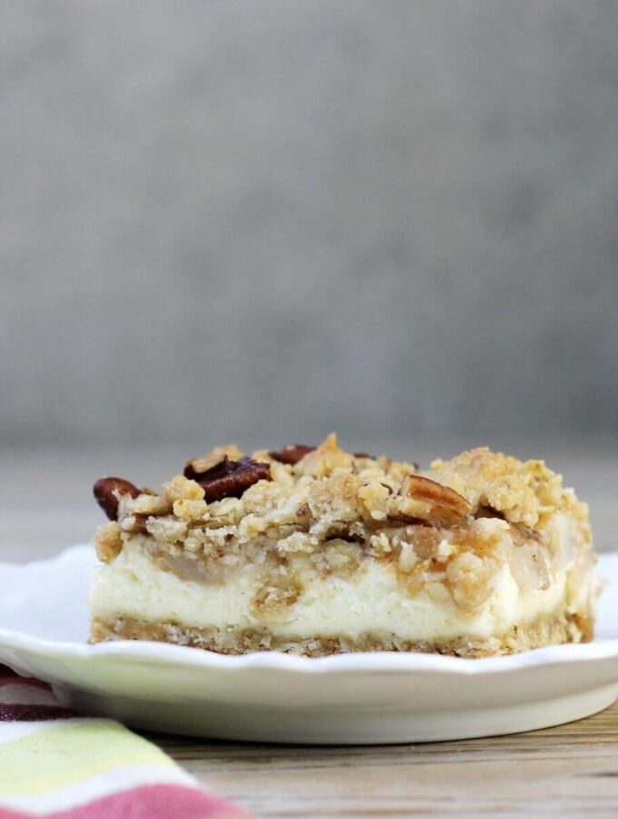 A side view of a white plate with a crumble bar on it.
