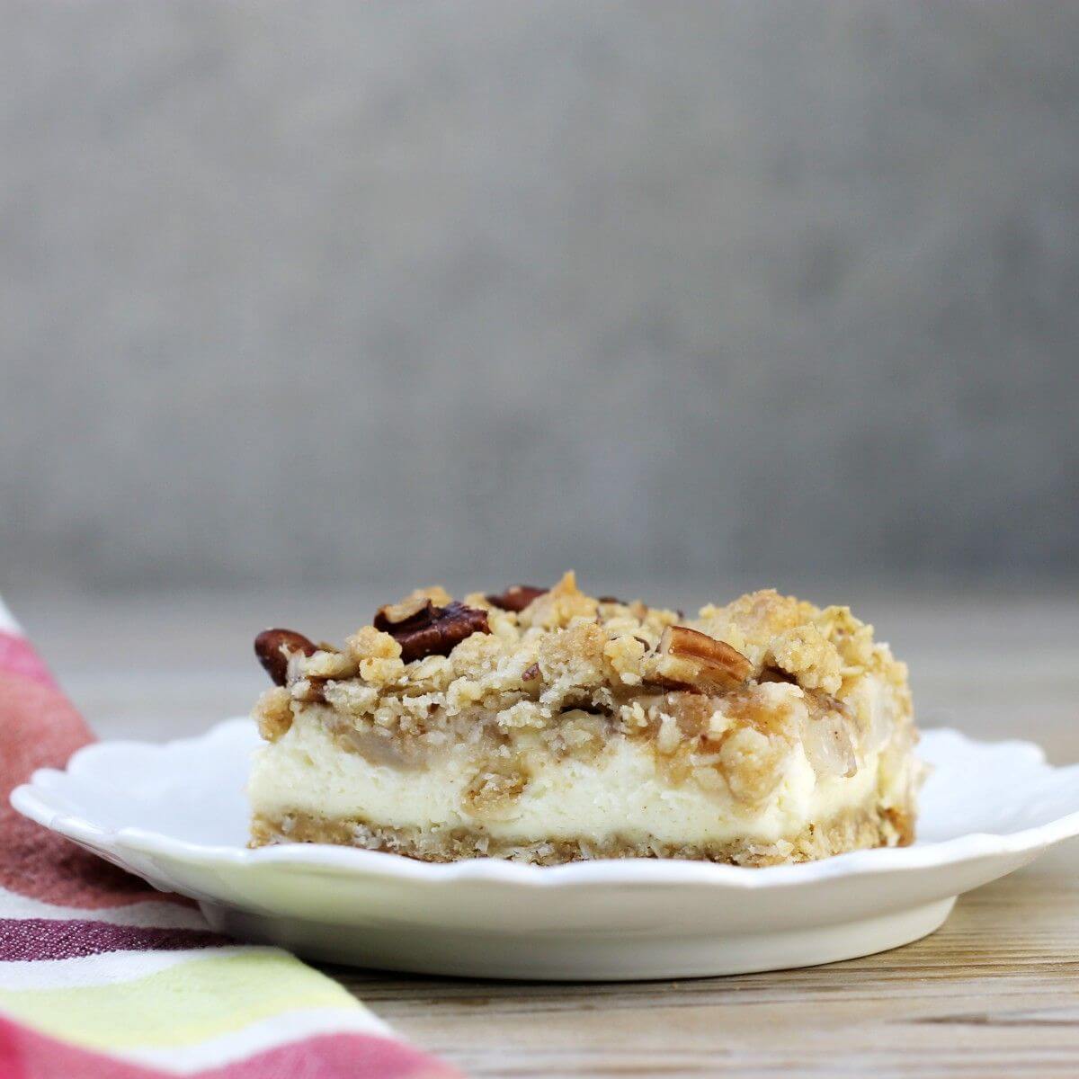 A side view of a white plate with a crumble bar on it.